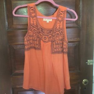 Sleeveless orange and blue shirt